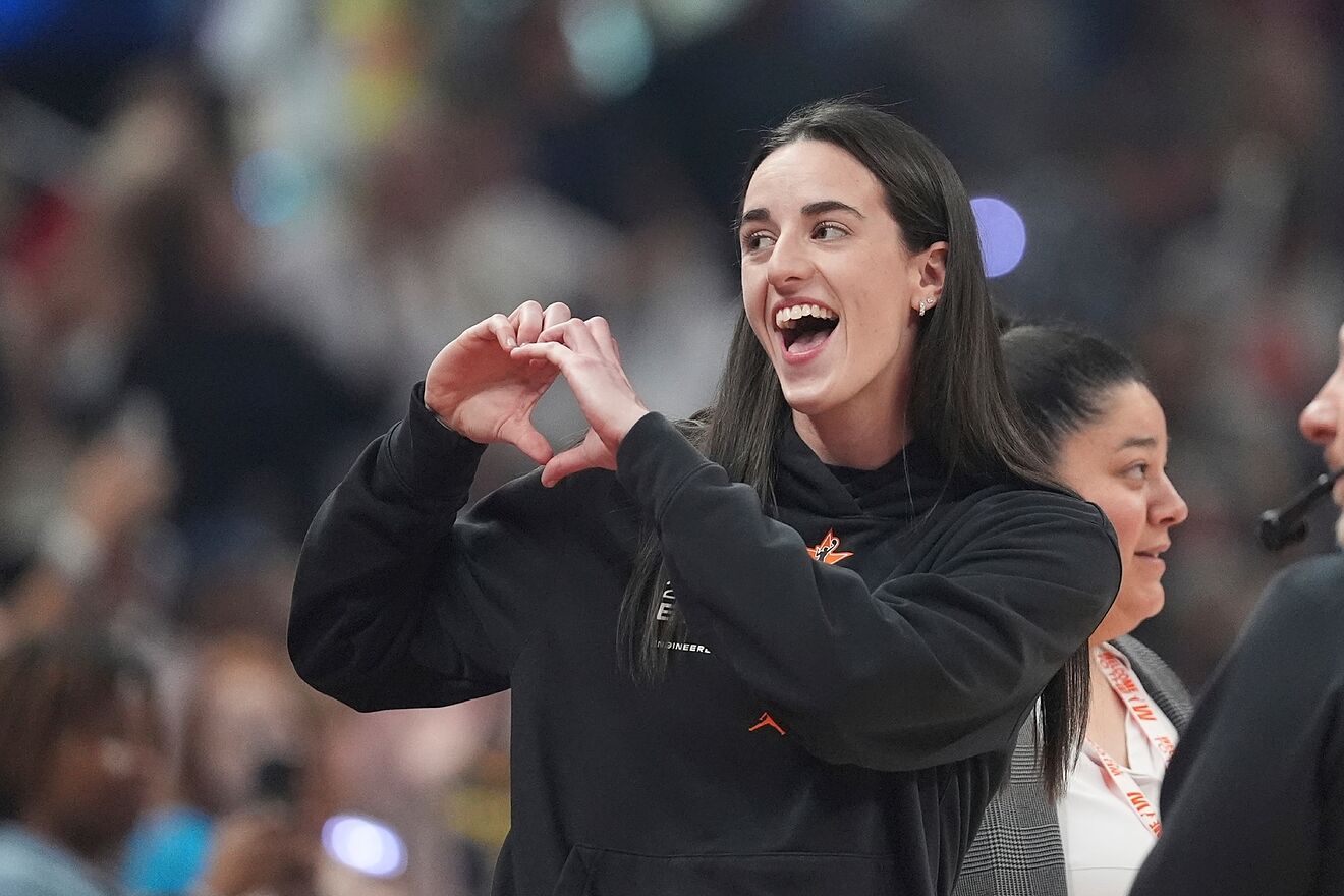 Caitlin Clark sends her support to one of her Fever teammates after a...
